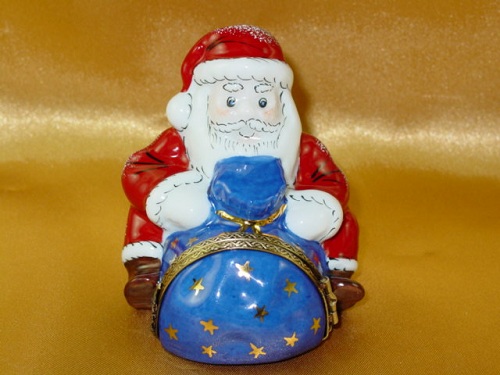 Santa sitting with gift bag
