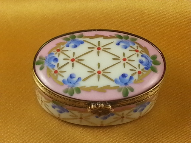 PINK OVAL WITH BLUE FLOWERS