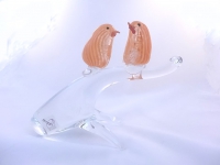 Two orange and sterling silver birds on a branch
