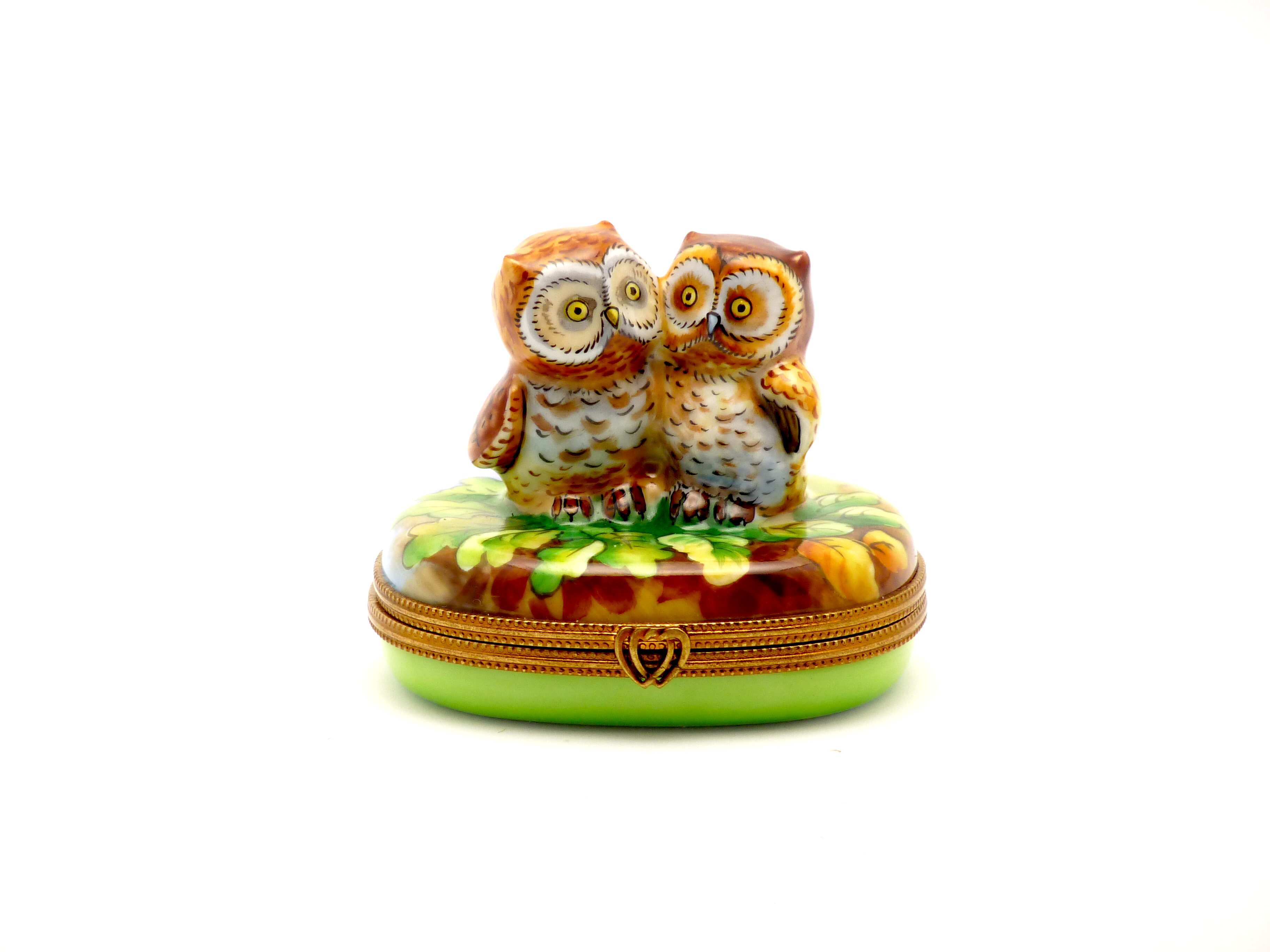 Owls on oval base