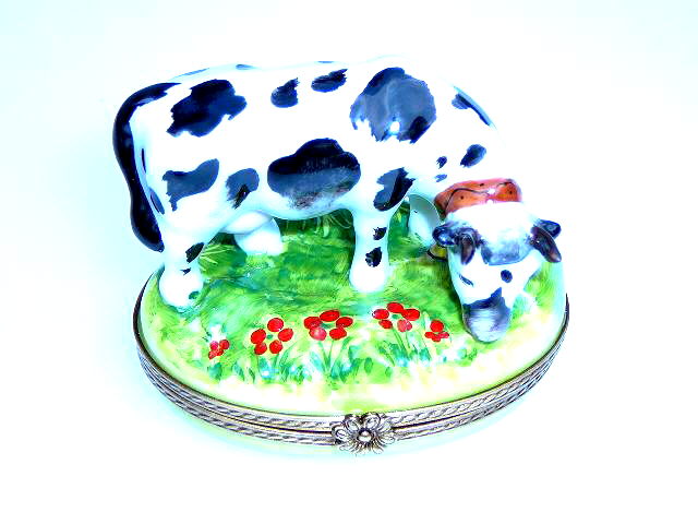 Cow on green oval base