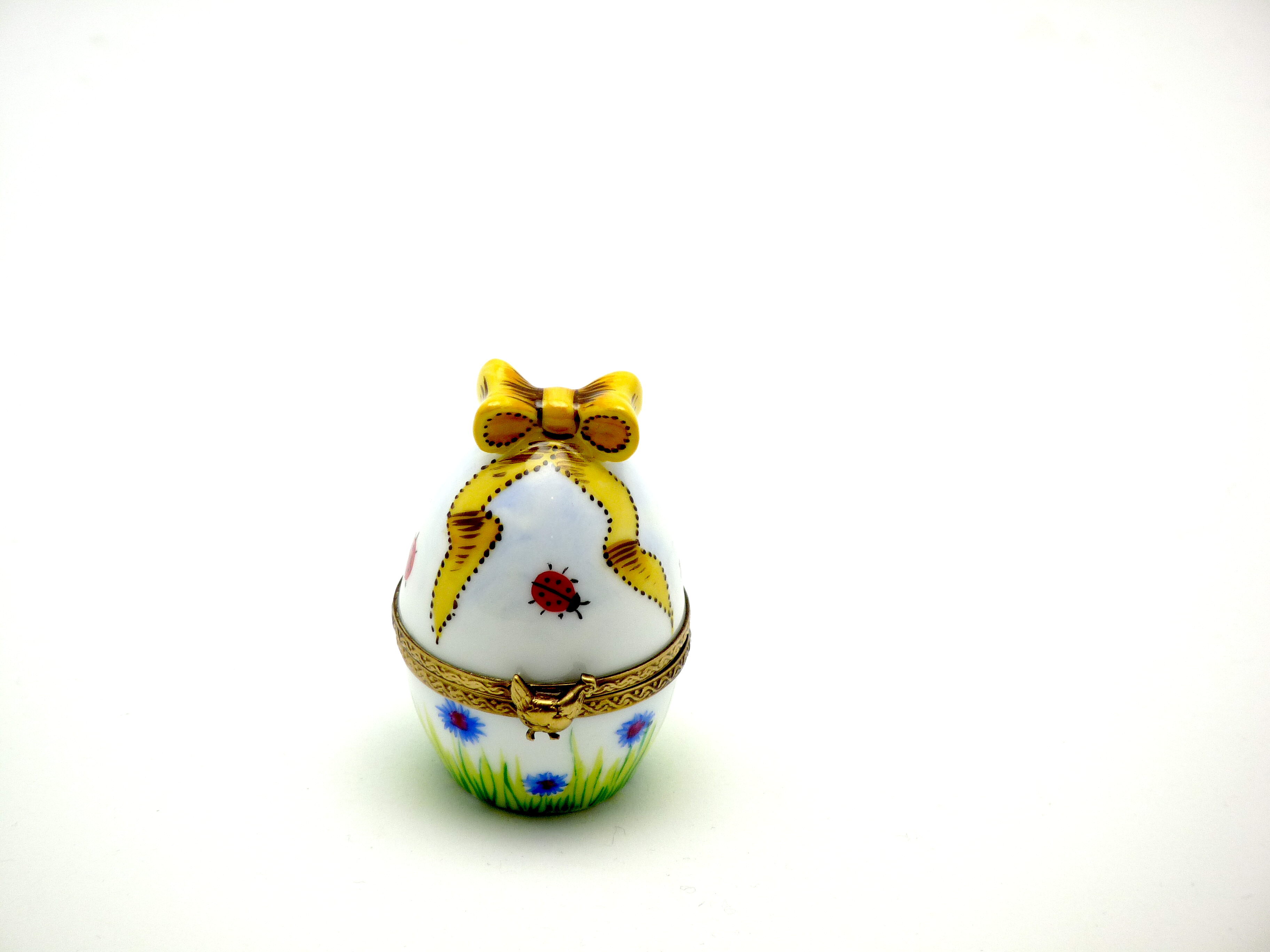 Upright egg with baby chick inside