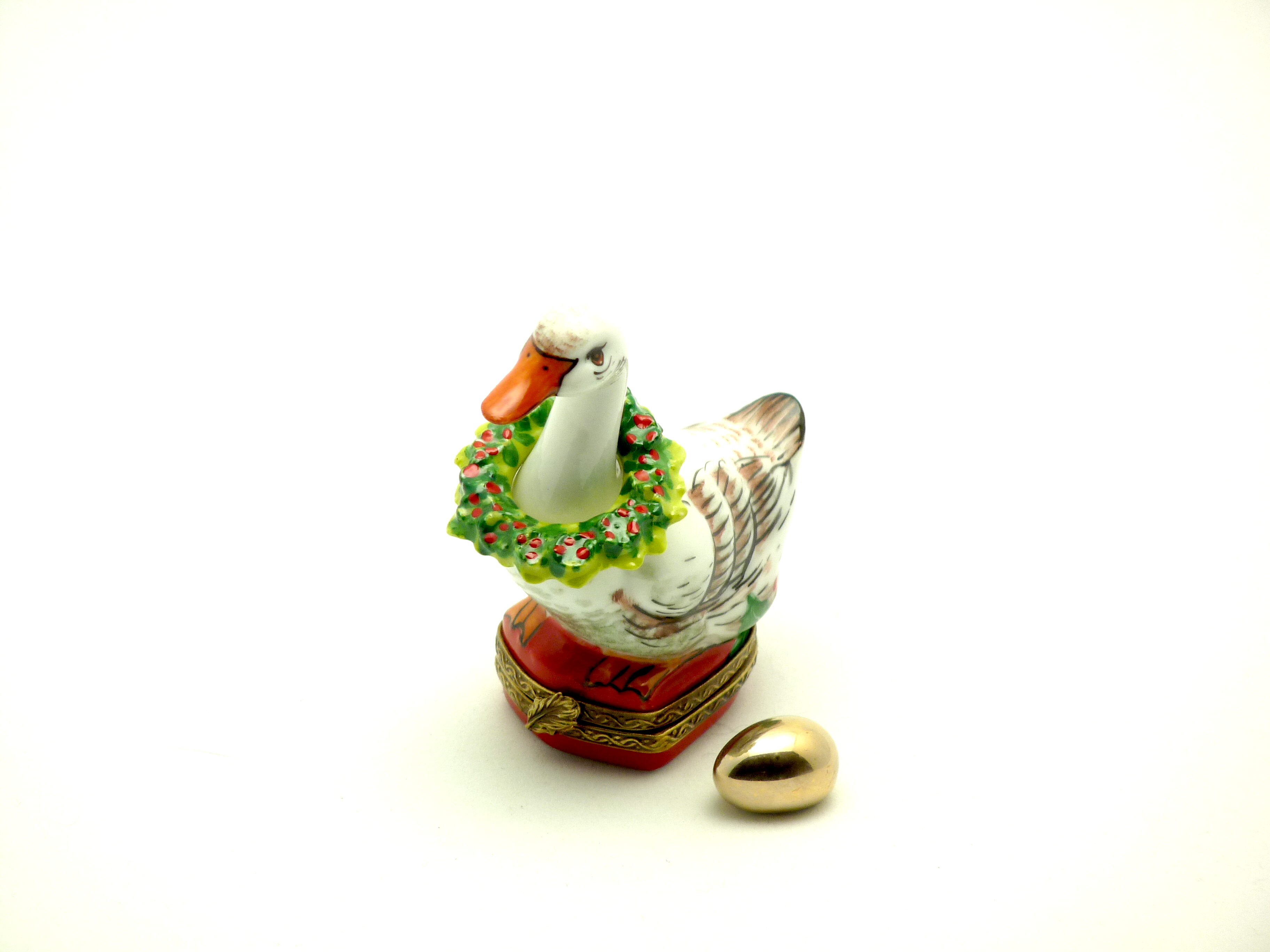 Goose with Christmas wreath and gold egg
