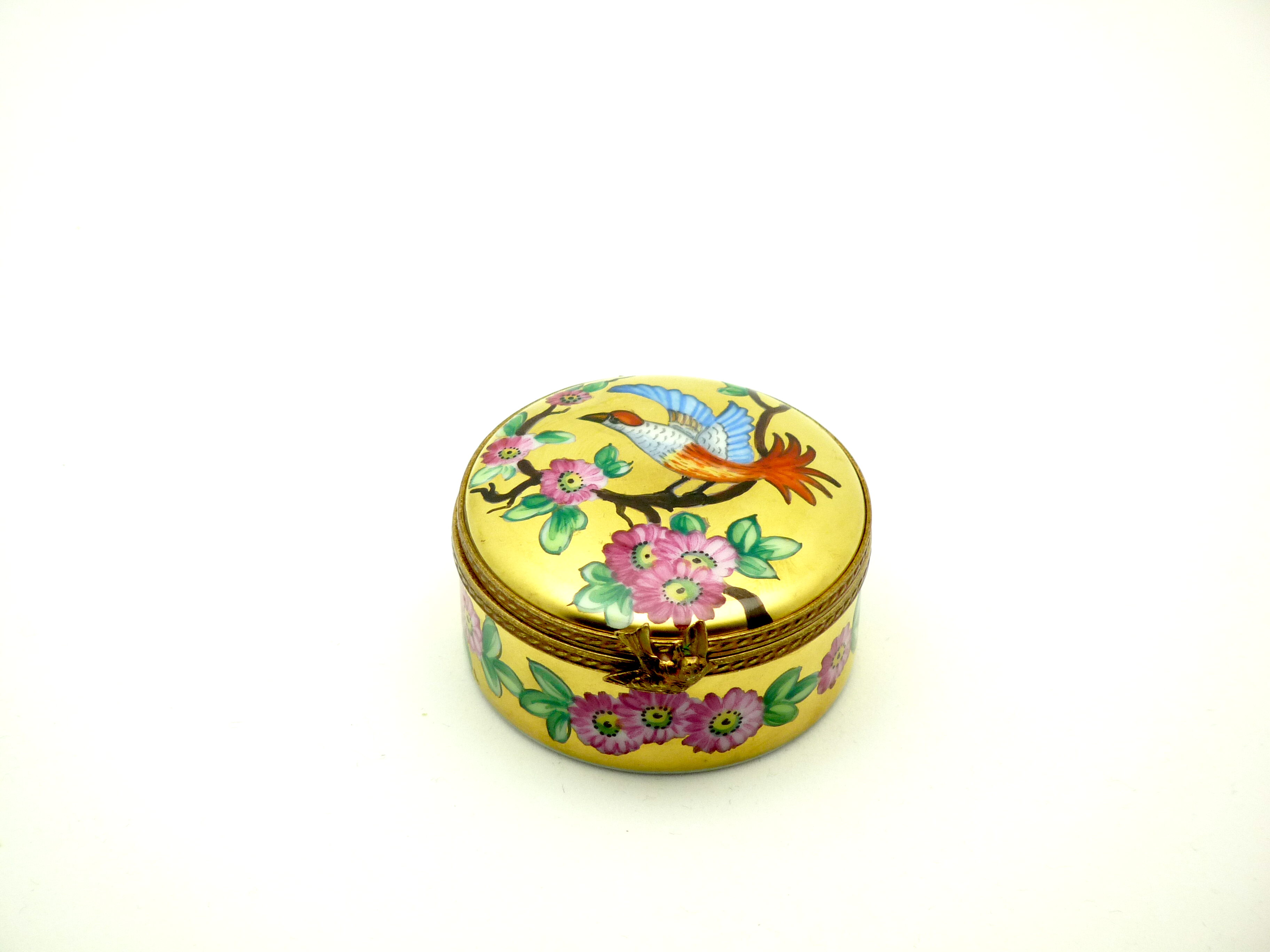 Round gold box with bird & flowers