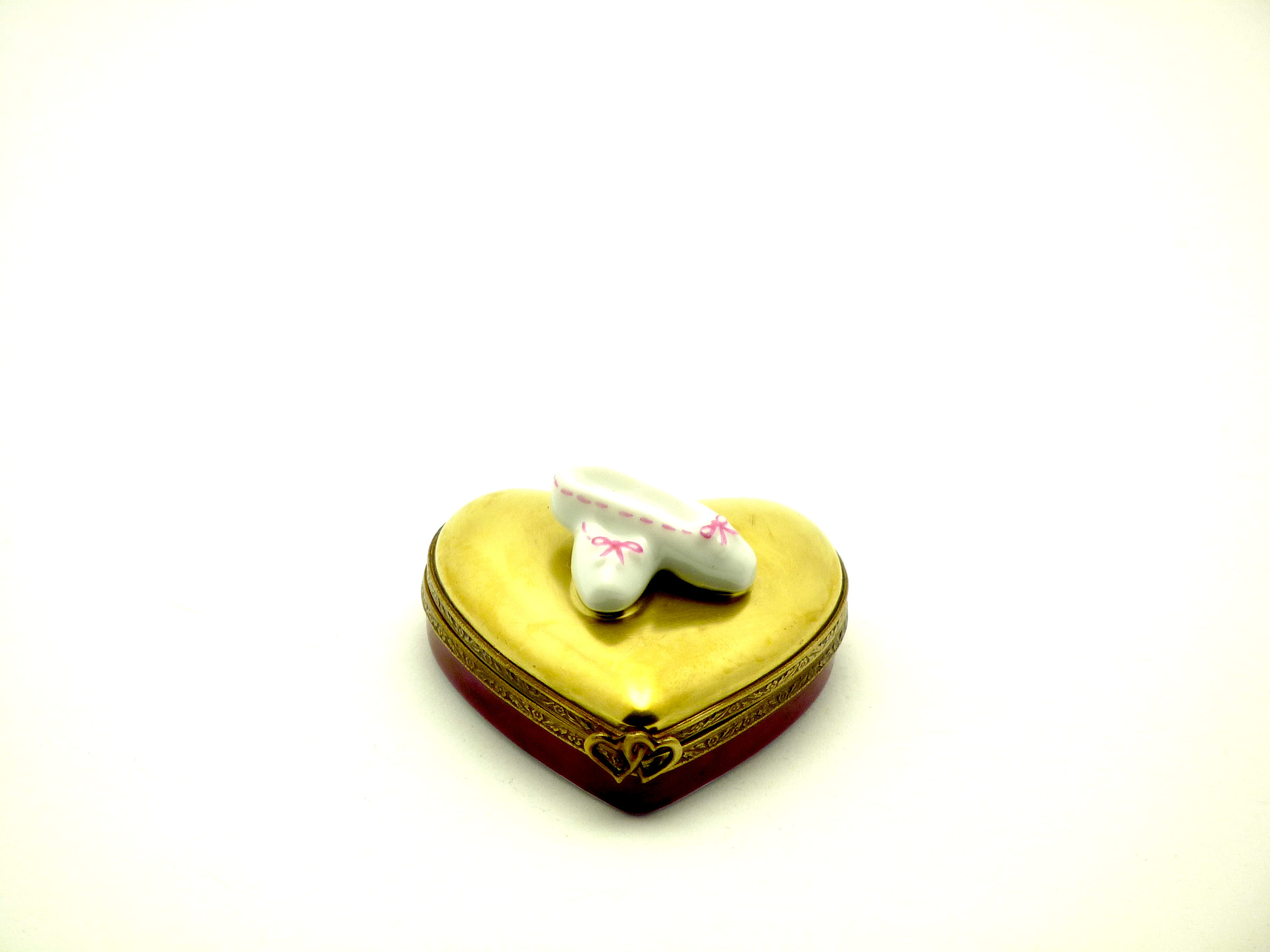 Ballet slippers on gold heart