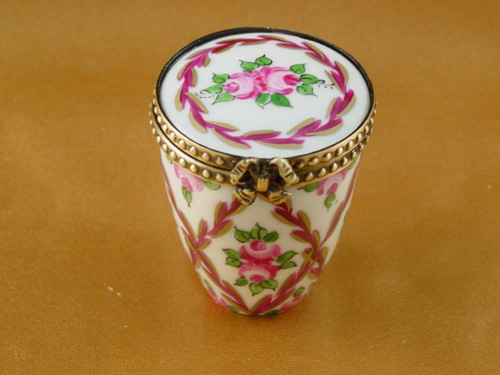 Burgundy and gold canister with flowers