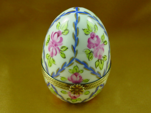 Egg with blue and gold stripes and flower