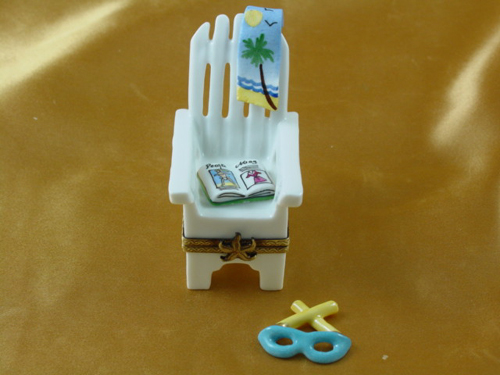 Adirondack chair with magazine beach towel and removable sunglasses