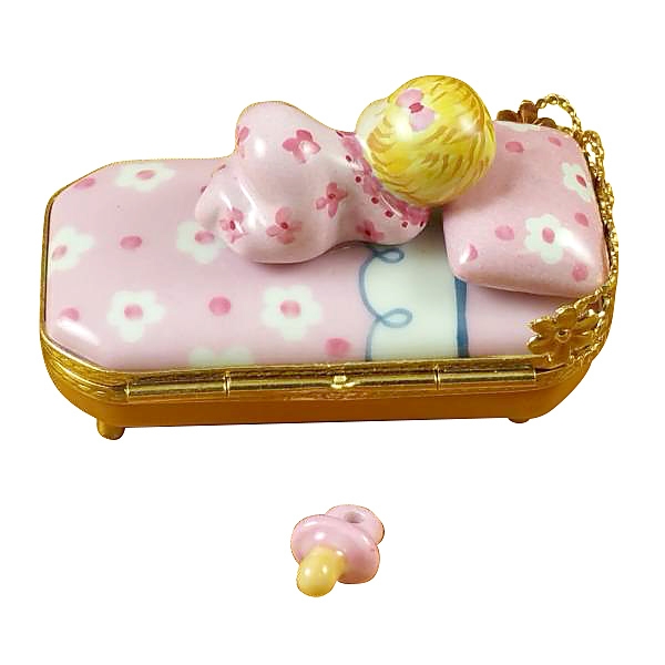 BABY IN PINK BED WITH PACIFIER