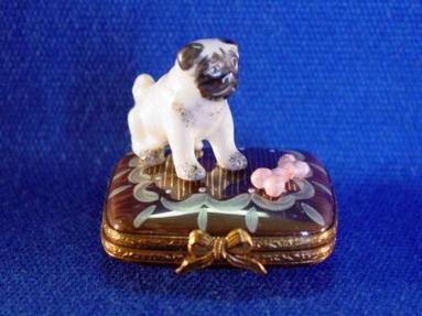 PUG ON BASE WITH BONE