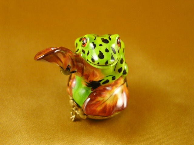 Frog playing w/leaf
