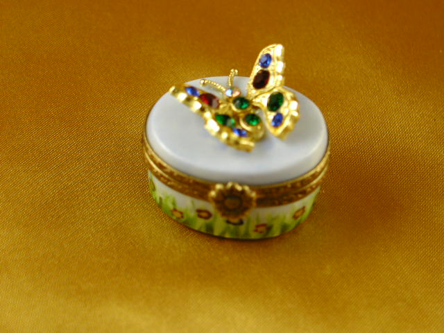 Jeweled butterfly on oval