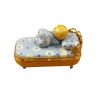 Baby in Blue Bed With Pacifier