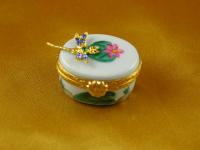Jeweled dragonfly on small oval