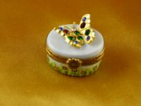 Jeweled butterfly on oval