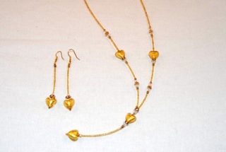Gold murano glass dangle heart necklace and earrings